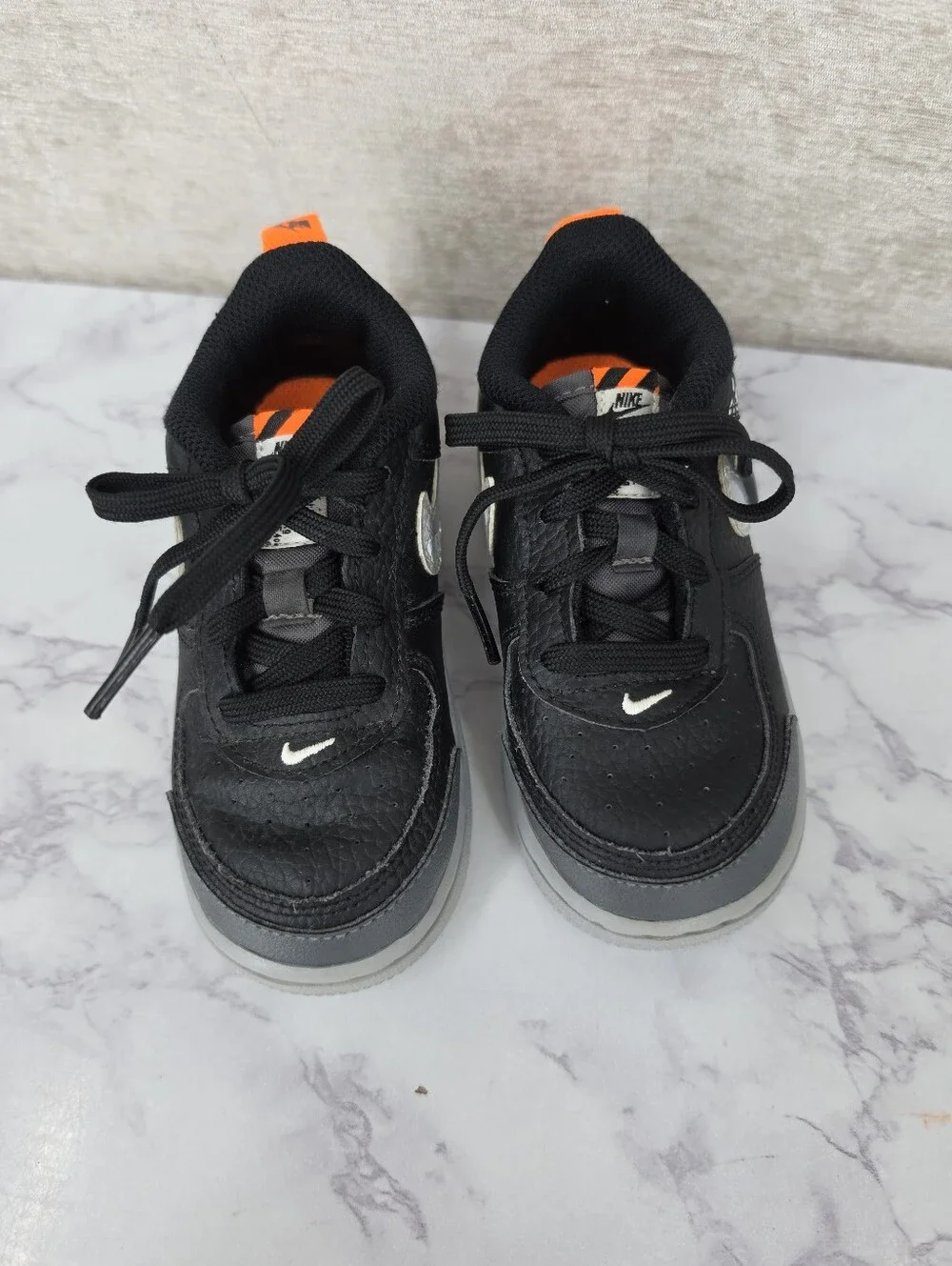 Nike Air Force Lv8 Kids Black & Gray Low-Top Sneakers with Orange Accent
